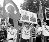 Uighurs and their supporters demonstrate in Paris on Saturday in support of the Muslim Uighurs from the Chinese Xinjiang province where violent clashes erupted on July 5.