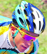  Race favourite Alberto Contador took the leader's yellow jersey when he surged less than six kilometres from the finish line to win the 15th stage on Sunday.