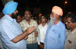 Mayor Baljeet Singh Birbehman listening to the grievances of residents of ward number 43 in Bathinda late on Monday evening.