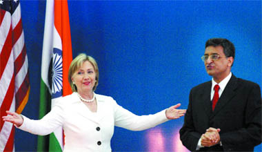 US Secretary of State Hillary Clinton gestures while Vice-Chancellor of Delhi University Deepak Pental looks on at Delhi University in New Delhi on Monday.