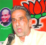 Haryana BJP chief Krishan Pal Gurjar addresses a press conference at the Chandigarh Press Club on Monday.