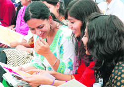 Students in a jubilant mood at the Haryana Pratibha Samman Samaroh in Chandigarh on Monday.