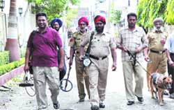 A dog squad at the industrial unit where the hoax bomb call was made, in Jalandhar 