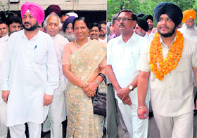 Bhupinder Singh Badheri of the Indian National Congress with party supporters and Akali-BJP candidate Malkiyat Singh before filing nomination papers at Chandigarh Election Commission office in Chandigarh on Tuesday.