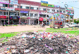 Garbage thrown at an open space in the market of Sector 16;