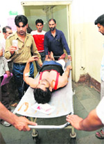 A wounded policeman being shifted to a hospital in Srinagar on Tuesday. 