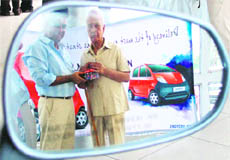 Rishi Dada, MD, Dada Motors, hands over the keys of the first Nano in Ludhiana on Tuesday.