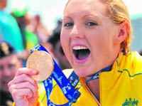 Australias Melissa Gorman celebrates on the podium after winning a gold in the Womens 5km Open Water competition at the FINA World Swimming Championships in Ostia on Tuesday. 