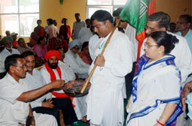 Lodging a protest, BJP district president (urban) Narinder Mittal along with his wife asking for alms during a party meeting held in Bathinda on Wednesday.