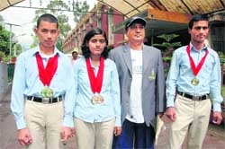 Sanjay, Gulshan and Gaurav Singh with their coach ML Mishra in Dehradun