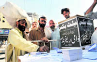 A man casts his ballot during a public referendum on the Kerry-Lugar Bill in Peshawar on Friday.
