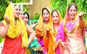Students of the BD Arya Girls College recite bolis during Teej celebrations at the college in Jalandhar on Friday. 