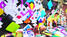 A vendor sells kites in Jammu.