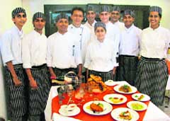 Chef Tan Ming Chau (centre) with students