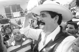 Ousted Honduras President Manuel Zelaya greets supporters at the Las Manos border station. 