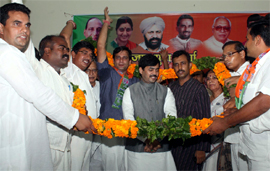 BJP leader Shahnwaz Hussein along with party workers at a meeting in Gurgaon on Sunday.