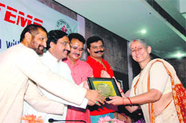 Dr Jyoti Sharma, a gynaecologist, receives Medical Execllence Award by Chief Minister Ramesh Pokhriyal Nishank in Dehradun on Sunday.