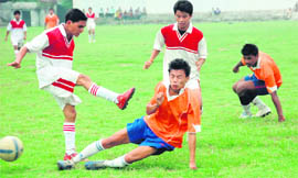 A match in progress at the Dehradun Football League on Sunday.