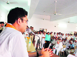 Sirsa MP Ashok Tanwar addresses representatives of panchayati raj institutions and Congress workers in Panchayat Bhawan, Fatehabad, on Sunday.