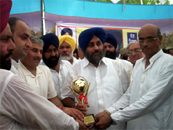 SAD state council member Sandeep Gilhotra and others presenting a memento to SAD president Sukhbir Badal at an election rally in village Rana.