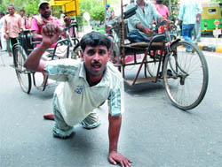 Differently abled people participate in a demonstration under the banner of Rashtriya Viklang Party at Jantar Mantar in New Delhi on Monday.