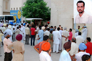 Locals at the Civil Hospital, Mansa, after the death of Dera Sacha Sauda follower Lili Kumar (inset) on Tuesday.