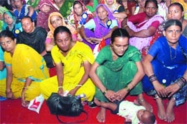 Women street vendors participate in Conference on Integrating Vendors in Urban India in New Delhi on Tuesday