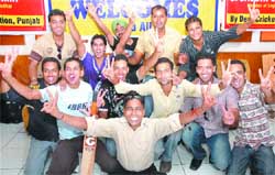 The cricket team celebrates its moment of glory. 