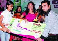 Punjabi pop and folk singer Preet Harpal honours Swarlata, a local budding artiste, with the Magic Voice of Punjab Award in Chandigarh. 