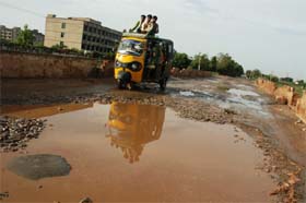 A view of the broken patch on Ballabhgarh-Sohna road near Alampur village in Faridabad