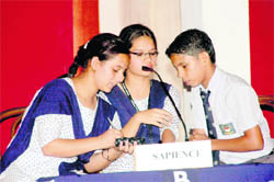 Pupils participate in Inter-School Quiz Competition in Dehradun on Wednesday. 