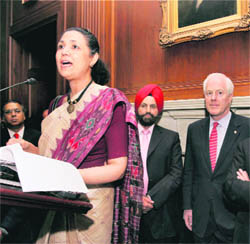 Indian Ambassador to US Meera Shankar speaks at a reception of US Senate India Caucus in Capitol Hill on Tuesday. Sant Chatwal, Chairman of the Indian-Americans for Democrats (L) can also be seen in the picture . 