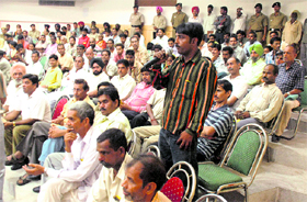 One of the participants in the eyes and ears scheme shares his experience with senior police officials at Bal Bhawan, Sector 24, Chandigarh, on Thursday.