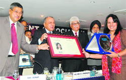 Punjab Governor Gen SF Rodrigues confers Trident Young Innovative Entrepreneur Award on Minnie Riat in Ludhiana on Thursday.