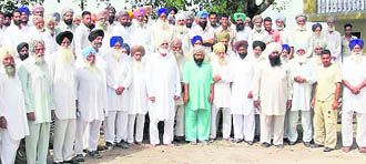 Farmers of six villages express solidarity with commission agents at Barsal village on Thursday.