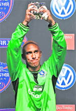 Evertons Tim Howard holds up the MVP trophy following the MLS All-Star soccer game in Sandy, Utah, on Wednesday. 