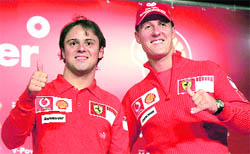 Michael Schumacher (R) and Felipe Massa