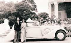  In this undated file picture, the Maharani Gayatri Devi of Jaipur with an unidentified man next to a custom built Rolls-Royce in Jaipur. 
