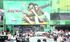 Movie buffs throng a cinema hall in Dehradun on Friday.