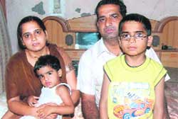 Harsh with his sister Harshita and parents at their home in Adarsh Colony, Patiala.
