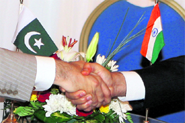 A file picture shows the handshake between Pakistan Prime Minister Yousuf Raza Gilani and his counterpart Manmohan Singh at NAM Summit in Egypt.