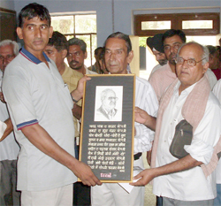 The memento presented to celebrity poet Mohan Aalok (extreme right) carried his sketch and poem. 