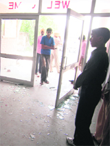 Broken panes of the main door to the Sunder Nagar division office in Ludhiana on Sunday.