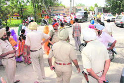 Policemen posted outside the Dera Sacha Sauda complex in Bathinda on Sunday to prevent any untoward incident during the naam charcha. 