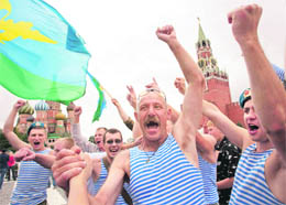 Former paratroopers wave flags celebrating a Russian Paratroopers' Day at the Red Square in Moscow on Sunday. Paratroopers are an elite unit of the Russian Army, and everyone in the country recognises their blue berets.