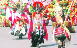Indonesian dancers perform during Jember fashion carnival in Jember, East Java, Indonesia, on Sunday.