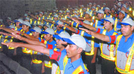Student volunteers take an oath during their induction ceremony under the 'Student Traffic Volunteers Scholarship Scheme 2009-10' in New Delhi on Monday.