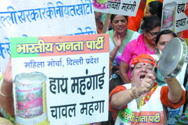 Women activists of the Delhi BJP Mahila Morcha protest against the state government on the issue of price rise at Jantar Mantar in New Delhi on Monday.