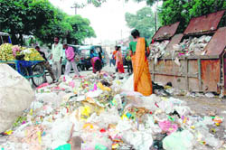 Garbage strewn around on one of the city roads. 