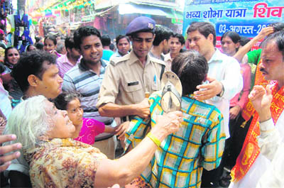 A pickpocket being thrashed by an old lady in Dehradun on Monday.